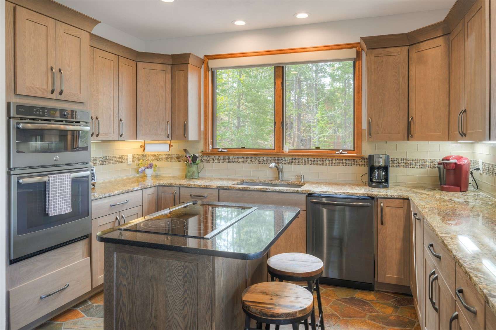 2542 Boreas Pass Road Breckenridge, CO 80424 - Photo 10 of 33 a kitchen with a sink stove and microwave