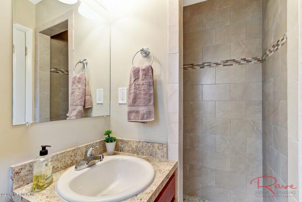 413 Baisden Road Jacksonville, FL 32218 - Photo 12 of 31 a bathroom with a sink and shower