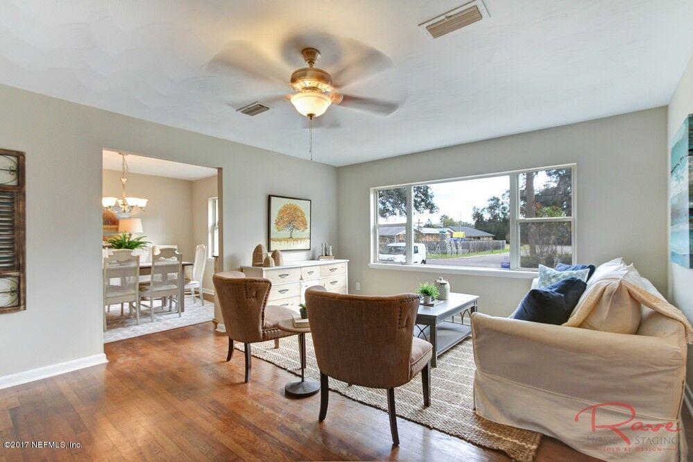 413 Baisden Road Jacksonville, FL 32218 - Photo 13 of 31 a living room with furniture and a large window