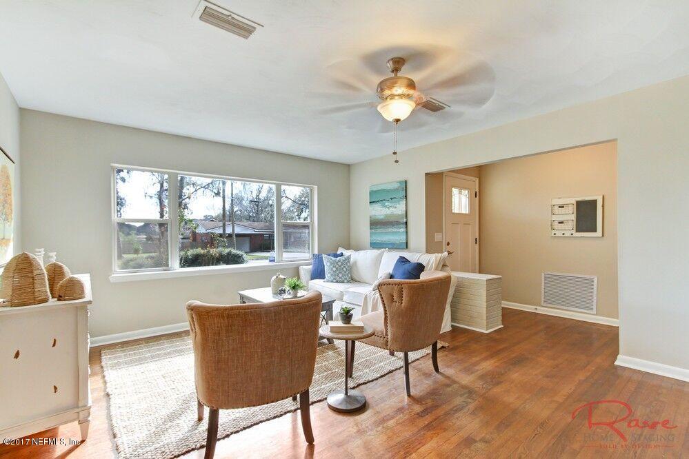 413 Baisden Road Jacksonville, FL 32218 - Photo 14 of 31 a living room with furniture and a large window