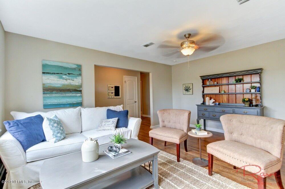 413 Baisden Road Jacksonville, FL 32218 - Photo 15 of 31 a living room with furniture and a large window