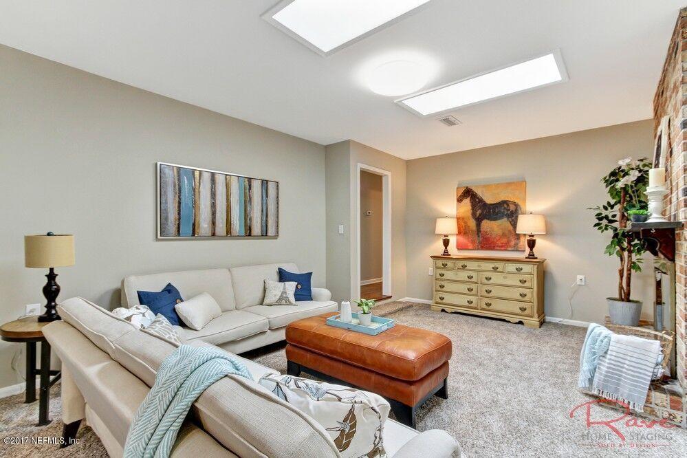 413 Baisden Road Jacksonville, FL 32218 - Photo 24 of 31 a living room with furniture and a flat screen tv