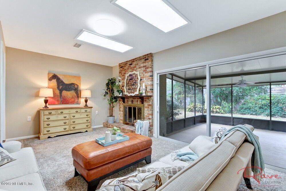 413 Baisden Road Jacksonville, FL 32218 - Photo 25 of 31 a bedroom with furniture and a floor to ceiling window