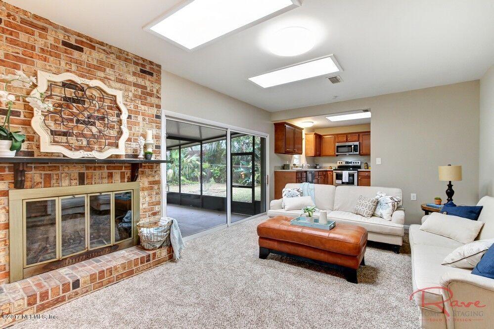 413 Baisden Road Jacksonville, FL 32218 - Photo 26 of 31 a living room with furniture and a fireplace