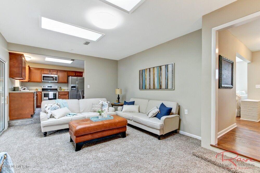 413 Baisden Road Jacksonville, FL 32218 - Photo 27 of 31 a living room with furniture and a couch