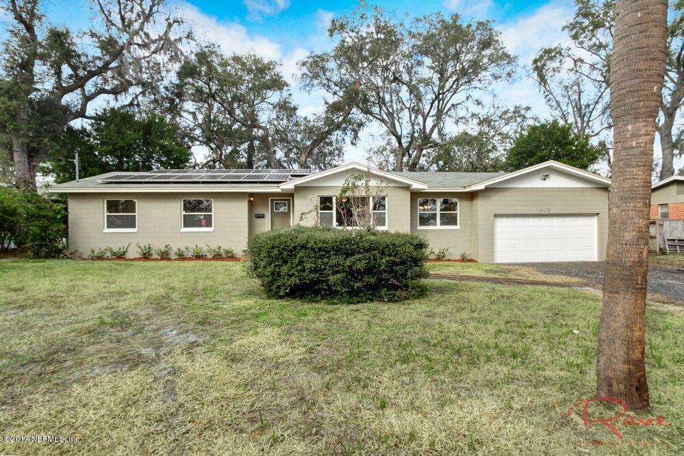 413 Baisden Road Jacksonville, FL 32218 - Photo 3 of 31 a front view of a house with a garden