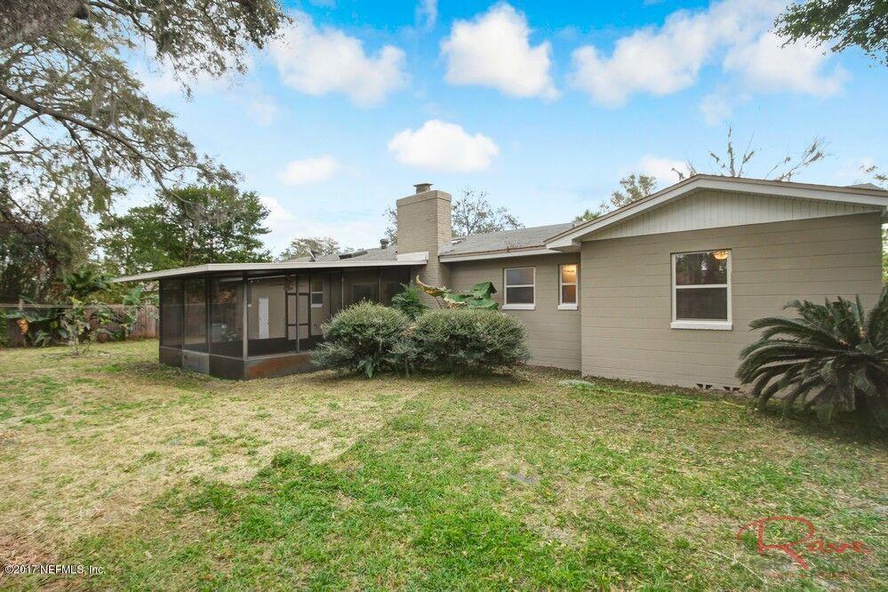 413 Baisden Road Jacksonville, FL 32218 - Photo 31 of 31 a view of a backyard with potted plants and a large tree