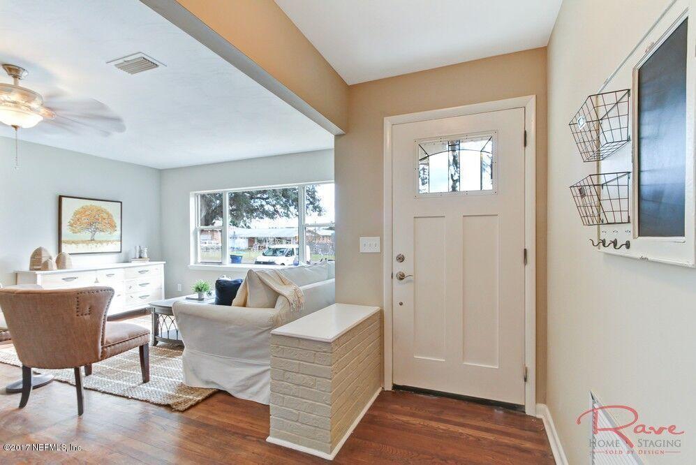 413 Baisden Road Jacksonville, FL 32218 - Photo 4 of 31 a living room with furniture and a large window