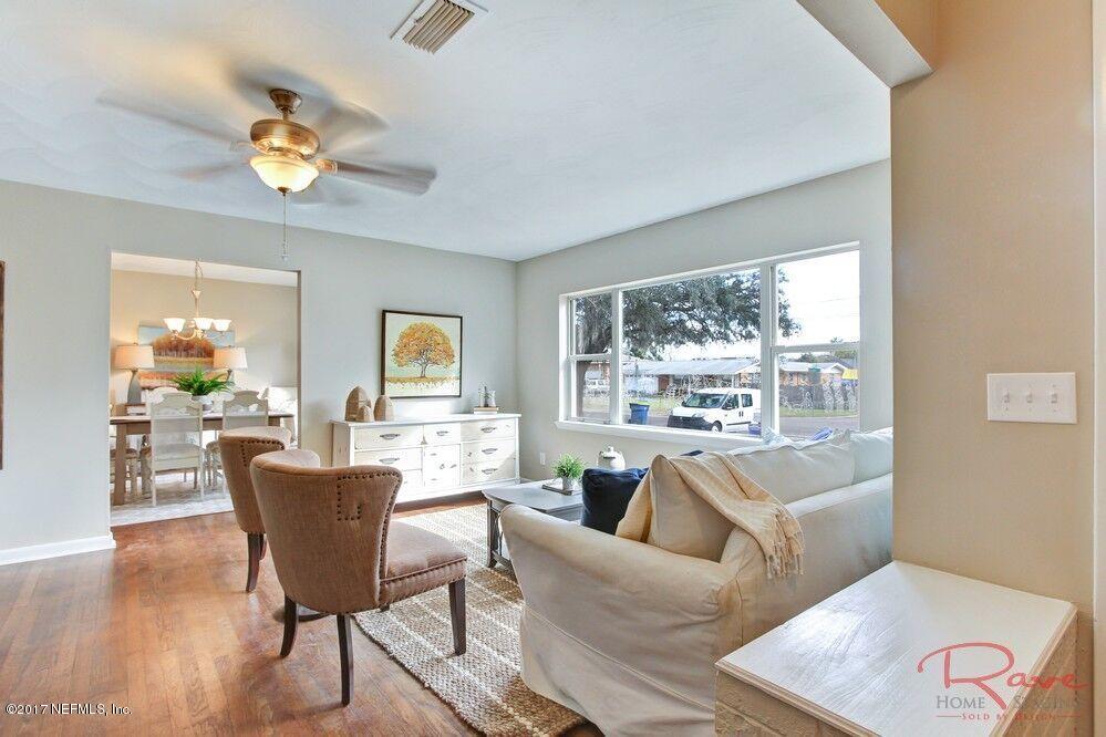 413 Baisden Road Jacksonville, FL 32218 - Photo 5 of 31 a living room with furniture and a large window