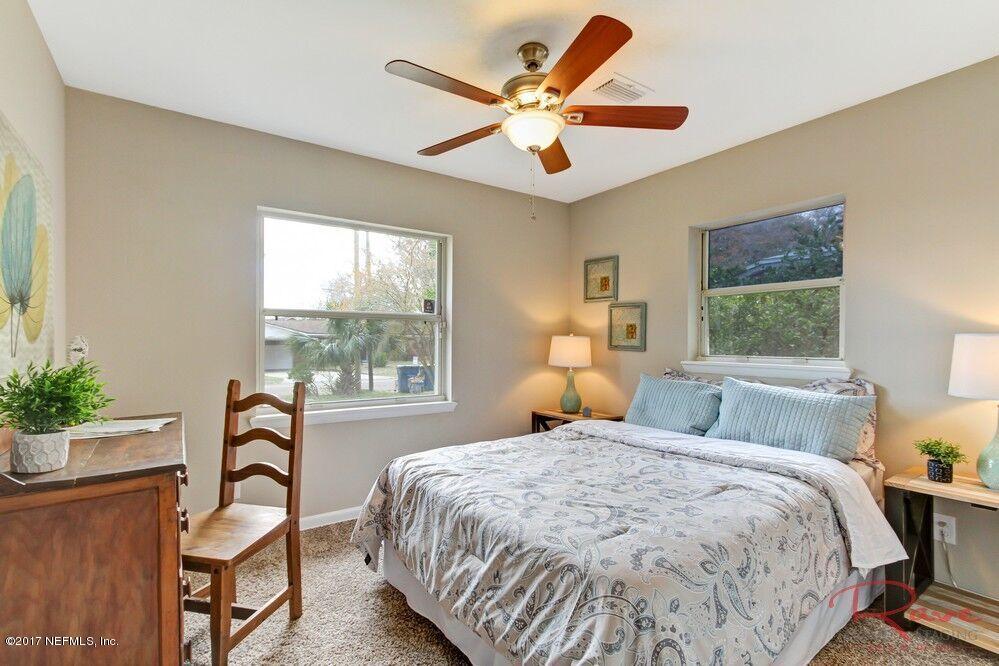 413 Baisden Road Jacksonville, FL 32218 - Photo 9 of 31 a bedroom with a bed and a window
