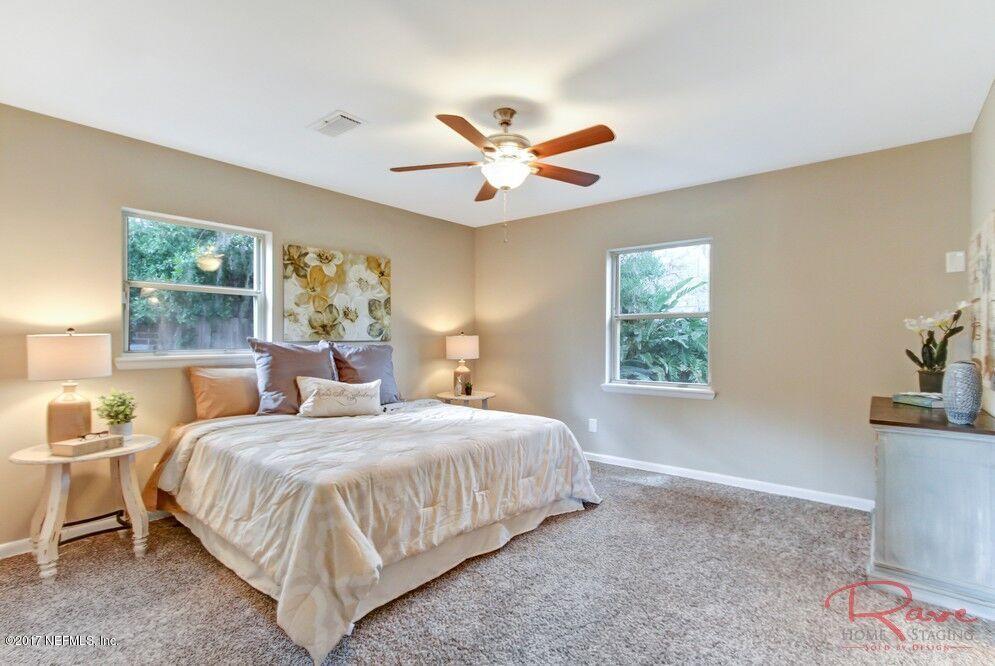 413 Baisden Road Jacksonville, FL 32218 - Photo 10 of 31 a bedroom with a bed and a window