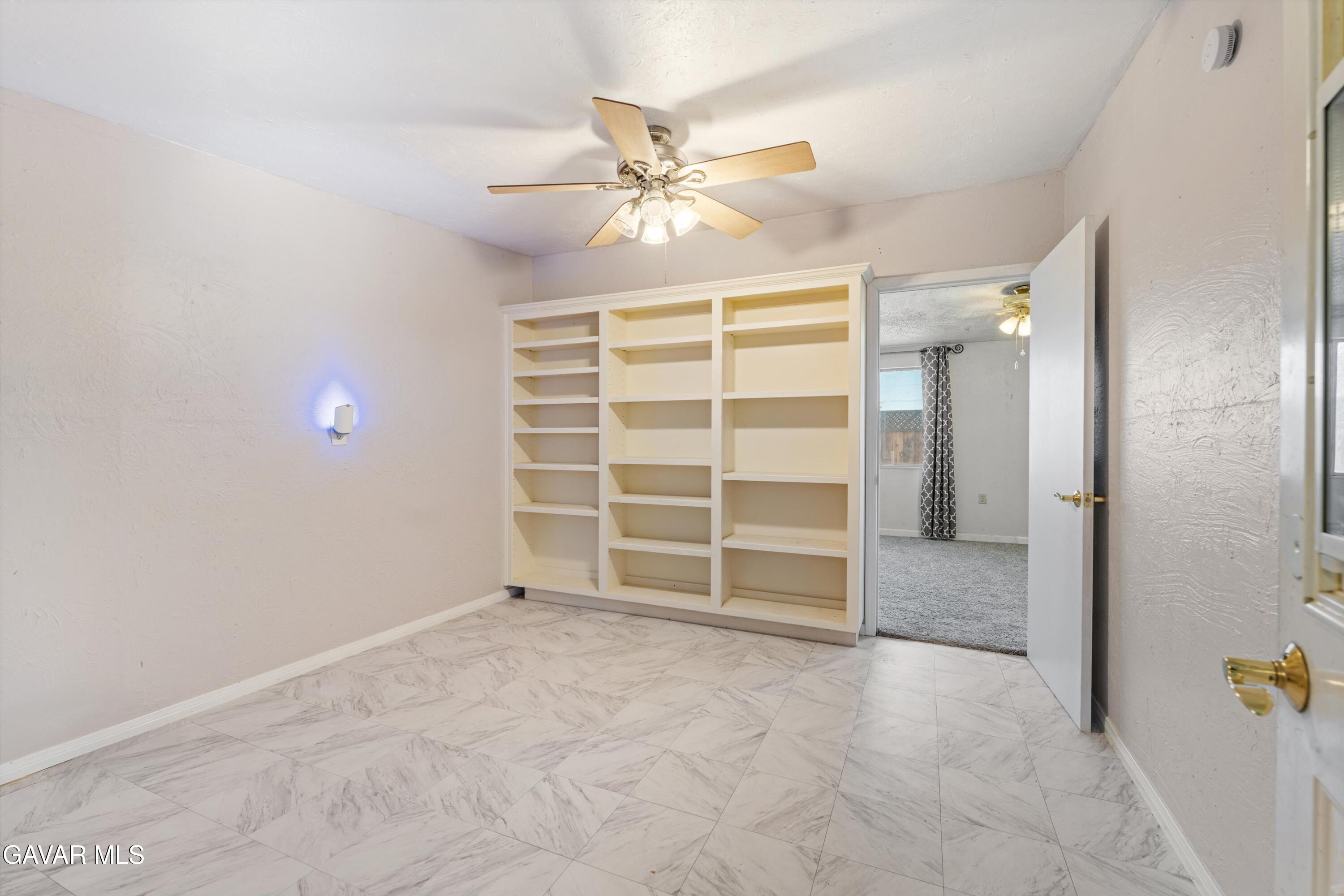 13445 Fran Street North Edwards, CA 93523 - Photo 8 of 27 a view of an empty room with a ceiling fan and bathroom