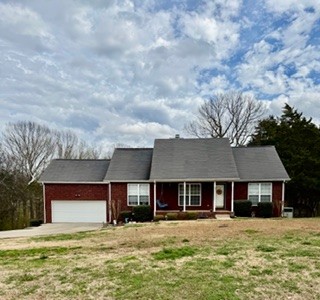 a house with yard in front of it