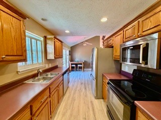 528 Windy Road Mount Juliet, TN 37122 - Photo 4 of 14 a kitchen with stainless steel appliances granite countertop a stove and a sink