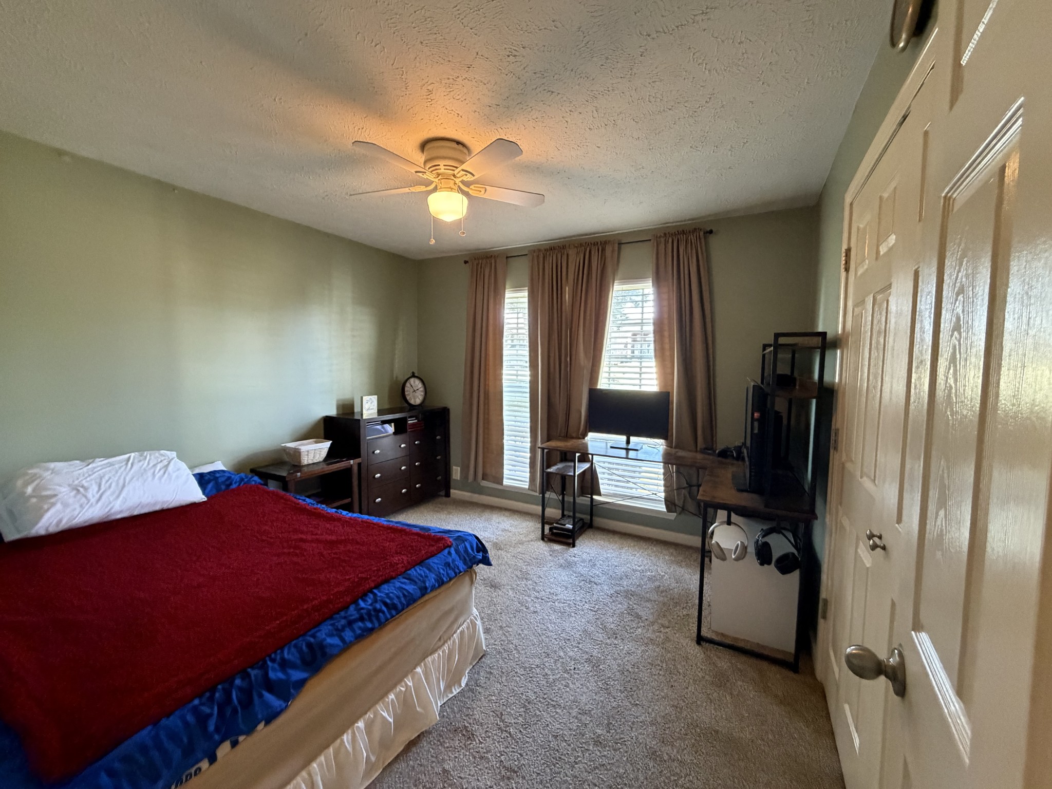 528 Windy Road Mount Juliet, TN 37122 - Photo 8 of 14 a bedroom with a bed and a chandelier