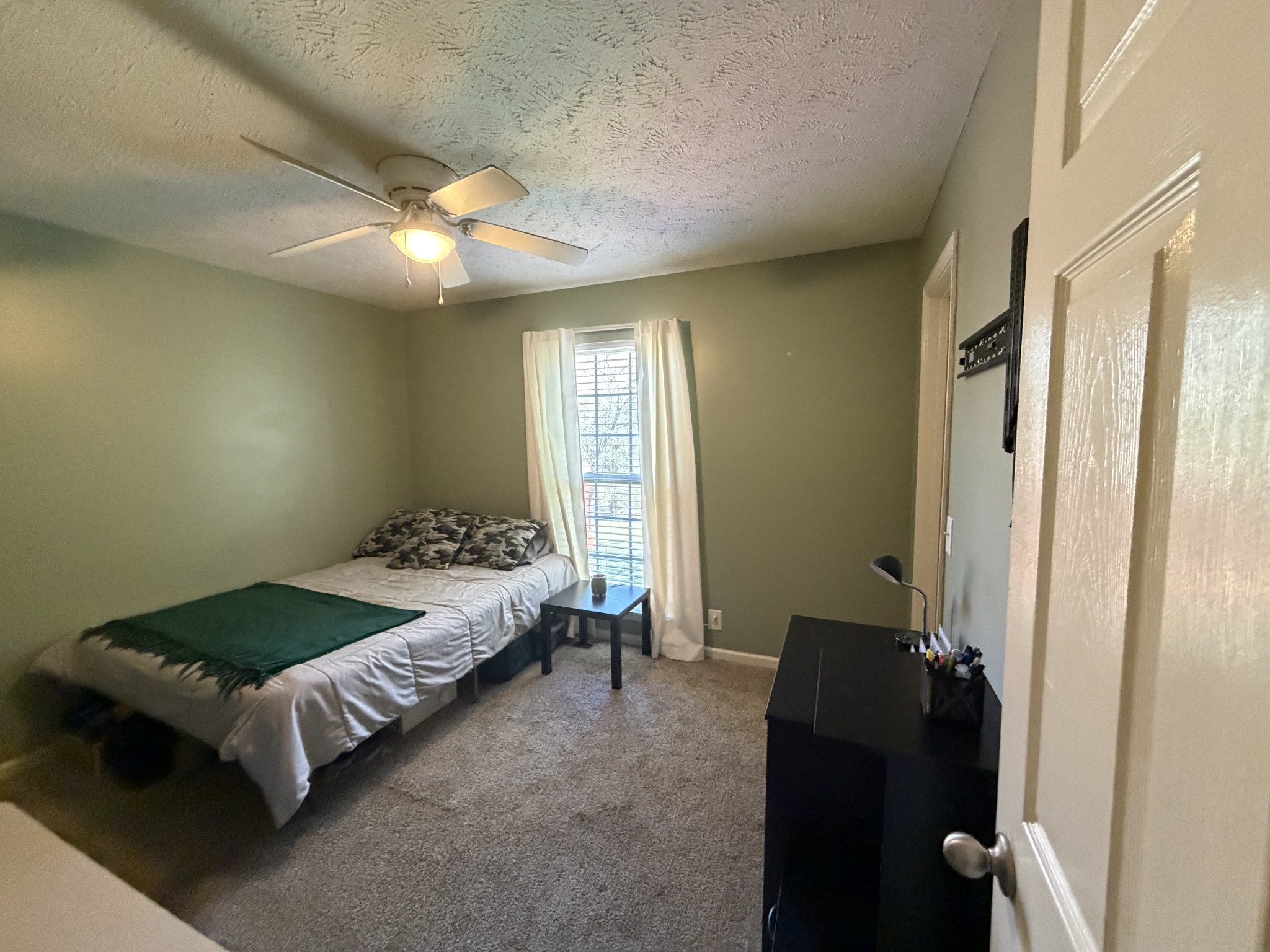 528 Windy Road Mount Juliet, TN 37122 - Photo 9 of 14 a bedroom with a bed and a chandelier