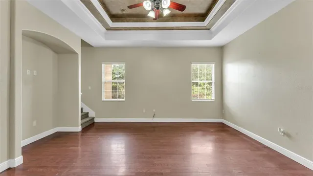 a kitchen with kitchen island granite countertop a sink stove and refrigerator