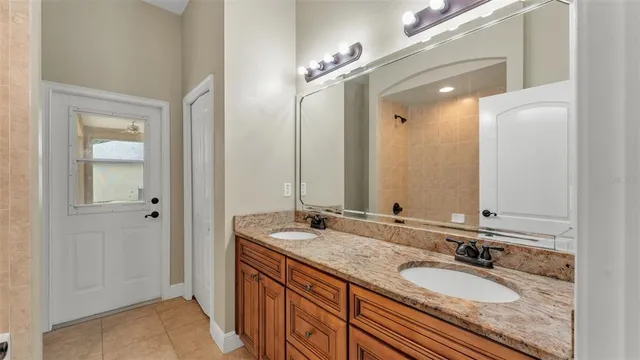 an empty room with a cabinet and a refrigerator