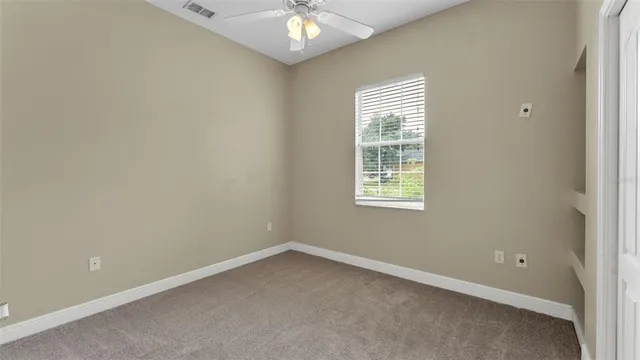 a front view of house with yard seating and green space
