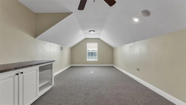 an aerial view of residential houses with outdoor space and river