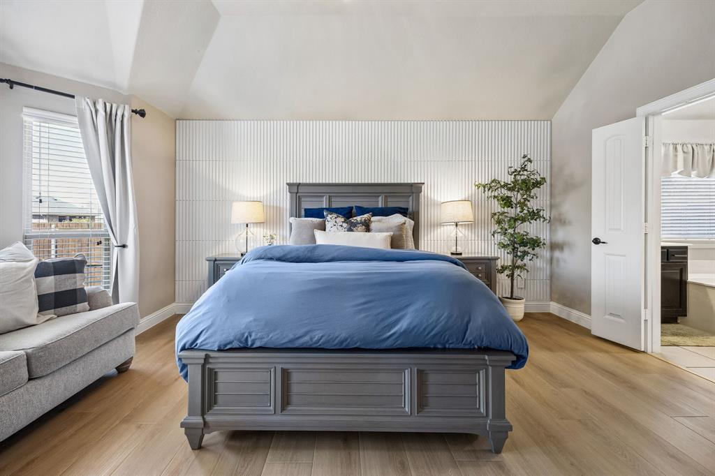 3917 Gatewick Drive Rockwall, TX 75087 - Photo 14 of 34 a spacious bedroom with a bed and a large window