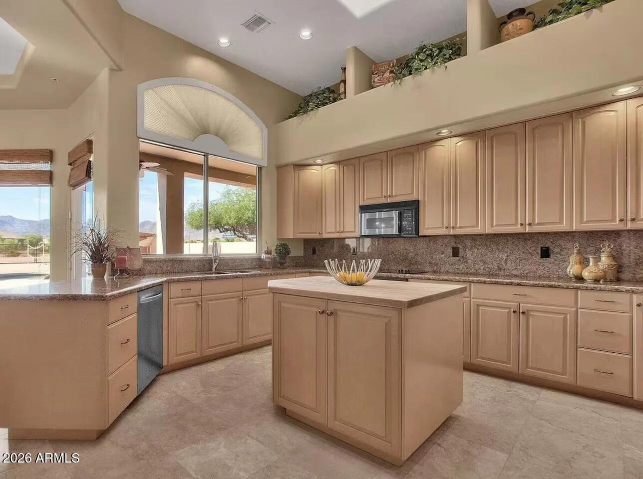 12198 East Doubletree Ranch Road Scottsdale, AZ 85259 - Photo 12 of 70 a kitchen with sink cabinets and window