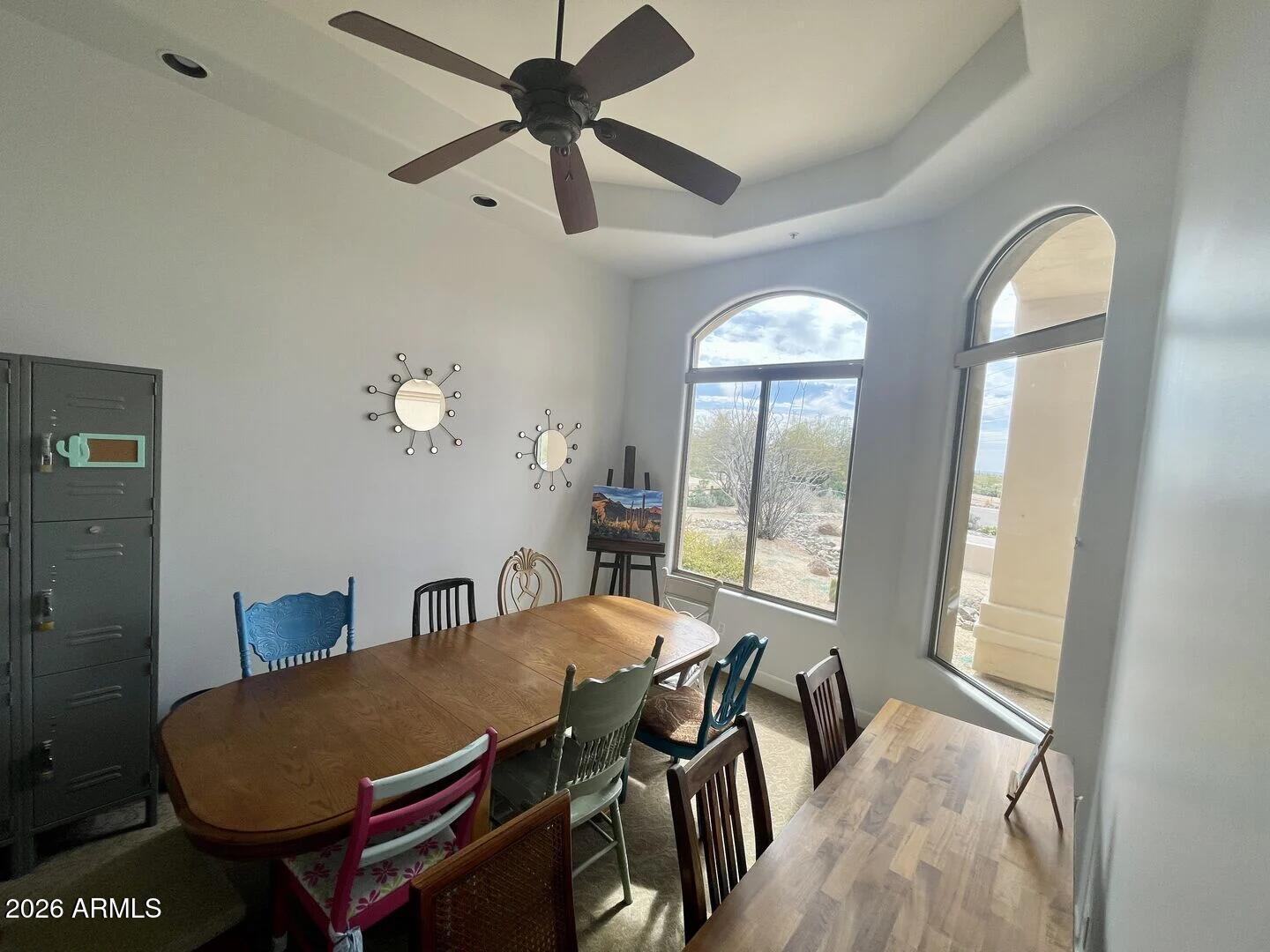 12198 East Doubletree Ranch Road Scottsdale, AZ 85259 - Photo 17 of 70 a view of a dining room with furniture and a large window