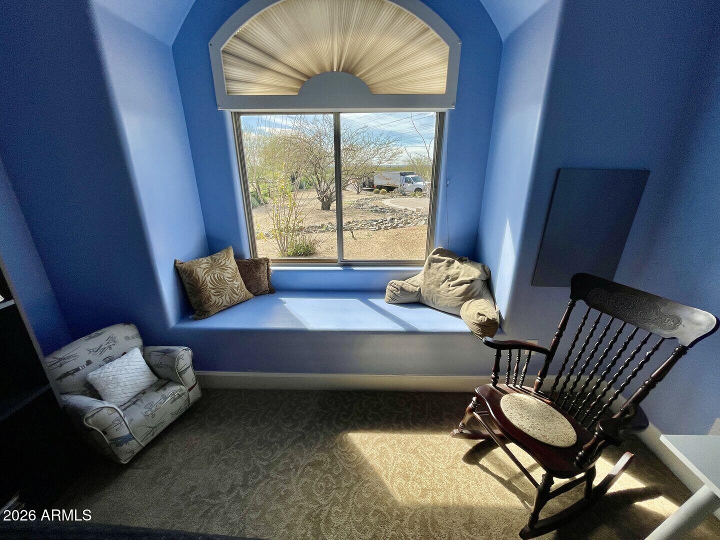 12198 East Doubletree Ranch Road Scottsdale, AZ 85259 - Photo 27 of 70 a living room with furniture and a window