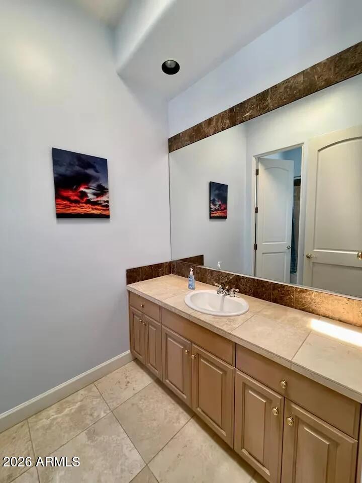 12198 East Doubletree Ranch Road Scottsdale, AZ 85259 - Photo 28 of 70 a bathroom with a sink and a mirror
