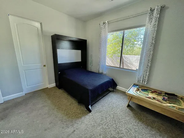 a view of a door and chair in the room