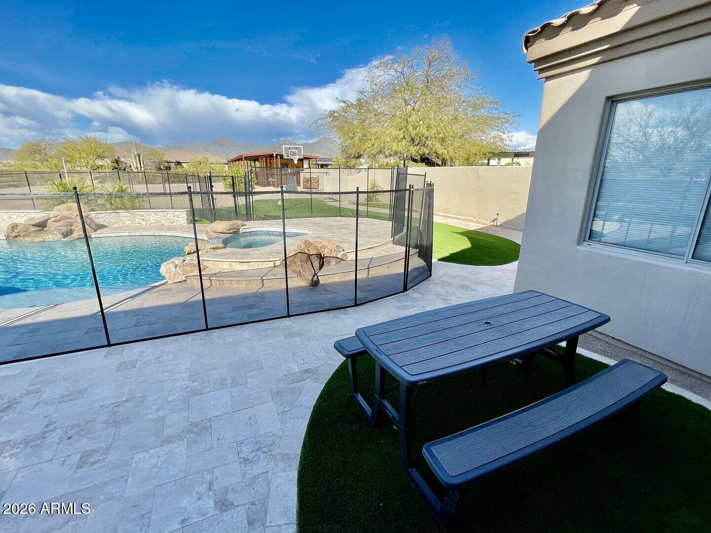 12198 East Doubletree Ranch Road Scottsdale, AZ 85259 - Photo 44 of 70 a view of a roof deck with a table and chairs