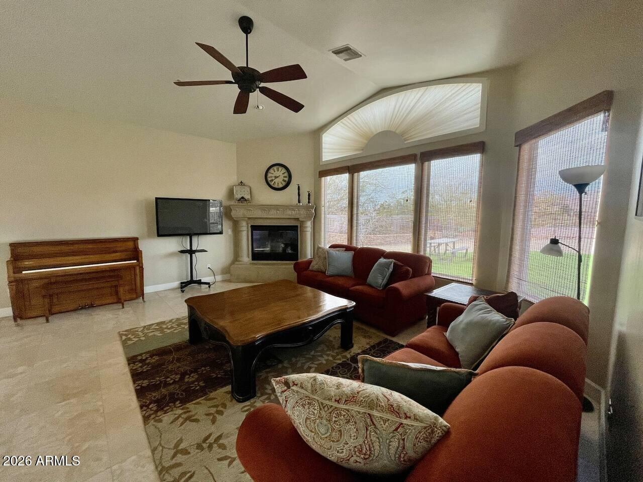 12198 East Doubletree Ranch Road Scottsdale, AZ 85259 - Photo 5 of 70 a living room with furniture a fireplace and a large window