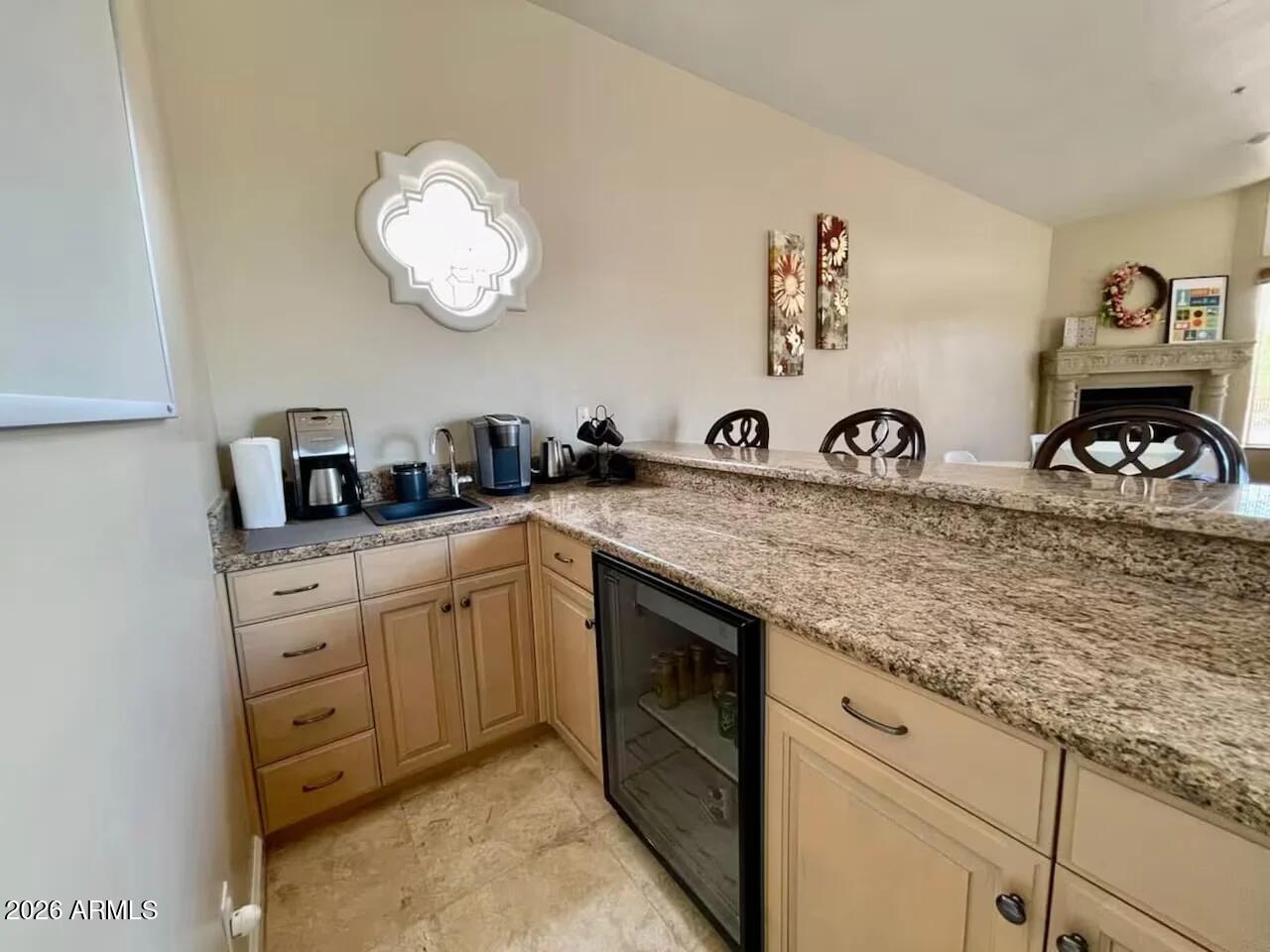 12198 East Doubletree Ranch Road Scottsdale, AZ 85259 - Photo 9 of 70 a kitchen with cabinets appliances and a sink