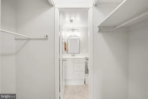 a bathroom with a sink a mirror and shower