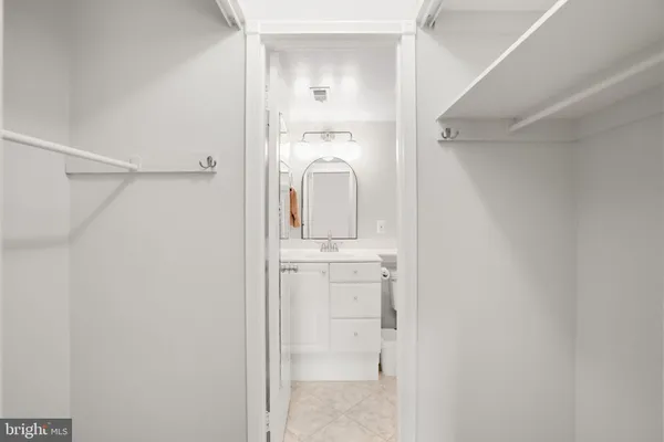 a bathroom with a sink a mirror and shower