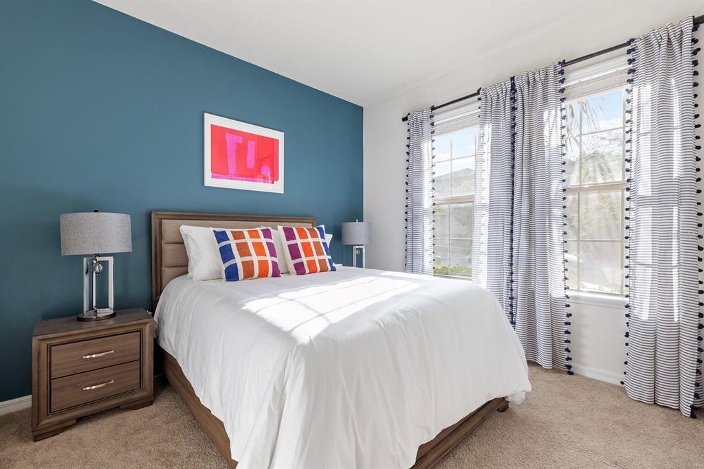 1864 Nice Court Kissimmee, FL 34747 - Photo 14 of 35 a bedroom with a bed and a window