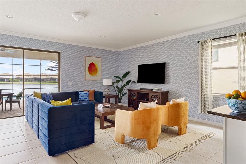 1864 Nice Court Kissimmee, FL 34747 - Photo 2 of 35 a living room with furniture and a flat screen tv
