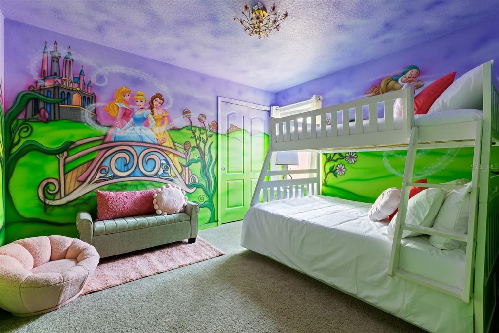 1864 Nice Court Kissimmee, FL 34747 - Photo 23 of 35 a bed room with a bed and a painting on the wall