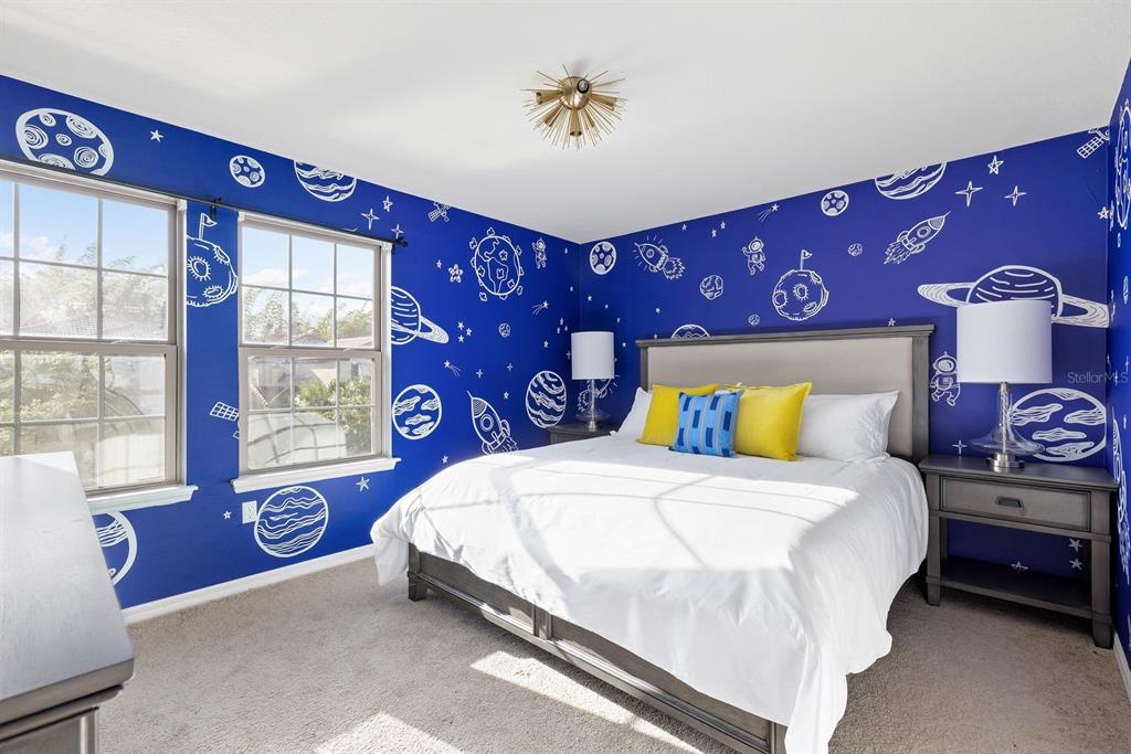 1864 Nice Court Kissimmee, FL 34747 - Photo 24 of 35 a bedroom with a bed and a window
