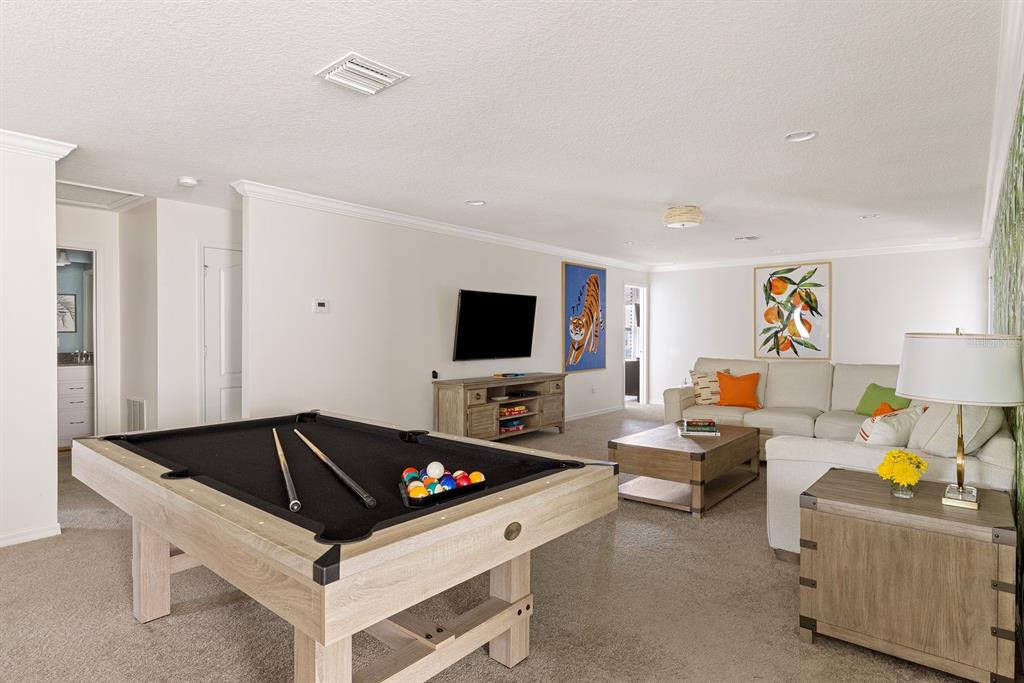 1864 Nice Court Kissimmee, FL 34747 - Photo 26 of 35 a living room with furniture and a flat screen tv