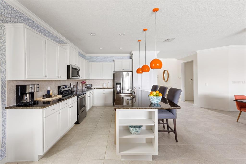 1864 Nice Court Kissimmee, FL 34747 - Photo 5 of 35 a kitchen view of living room and kitchen view