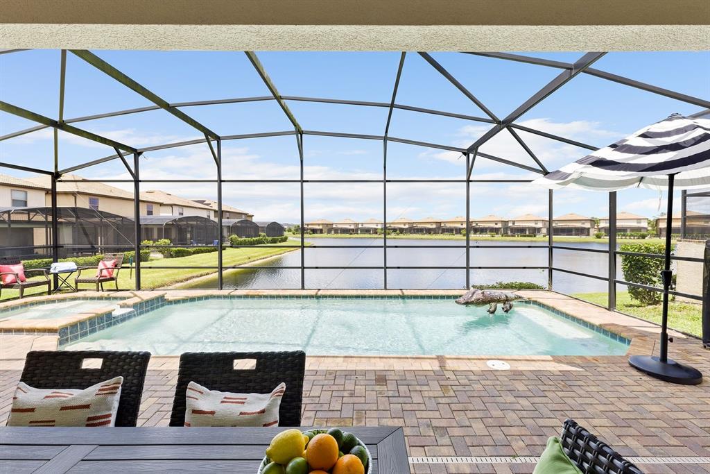 1864 Nice Court Kissimmee, FL 34747 - Photo 8 of 35 a view of a swimming pool with a lounge chair