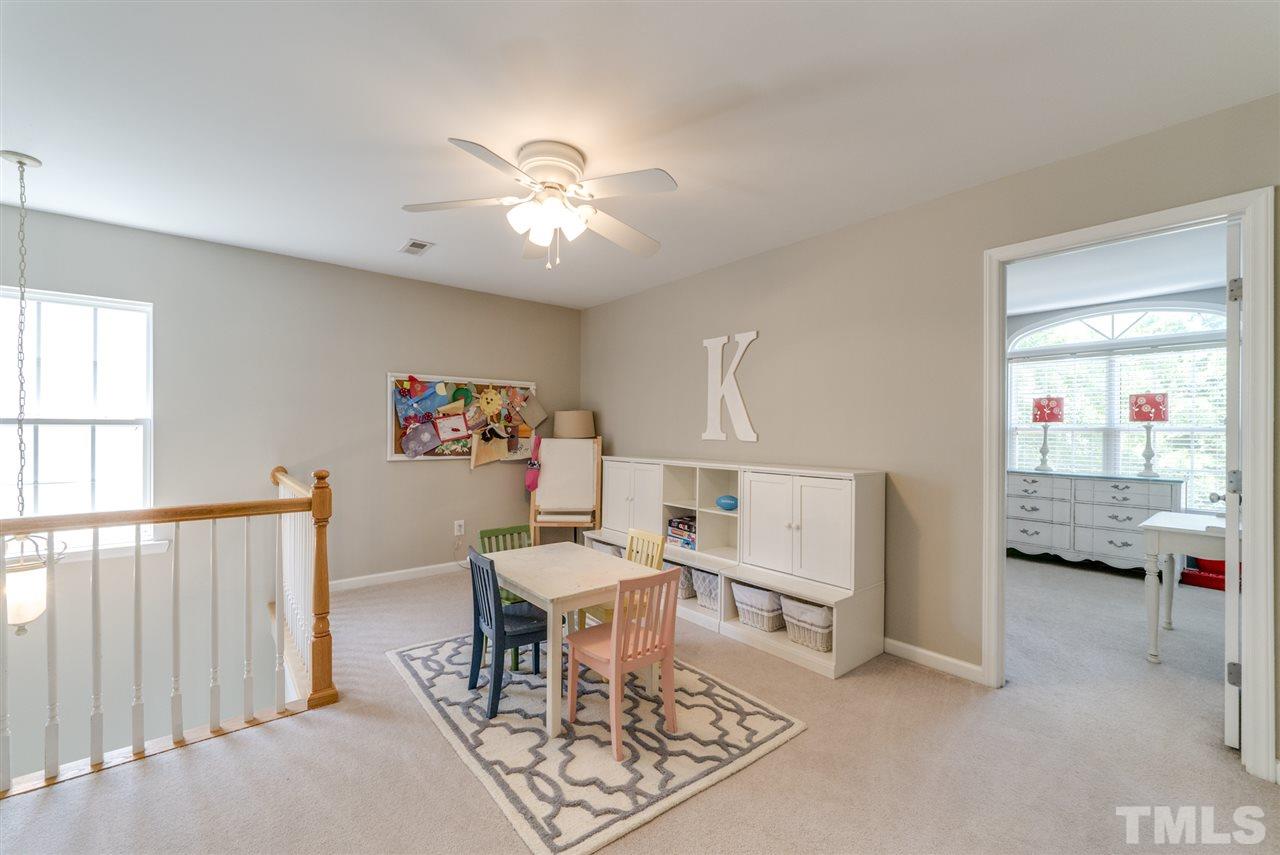 8404 Whisper Ridge Place Raleigh, NC 27613 - Photo 11 of 25 a living room with furniture and a window