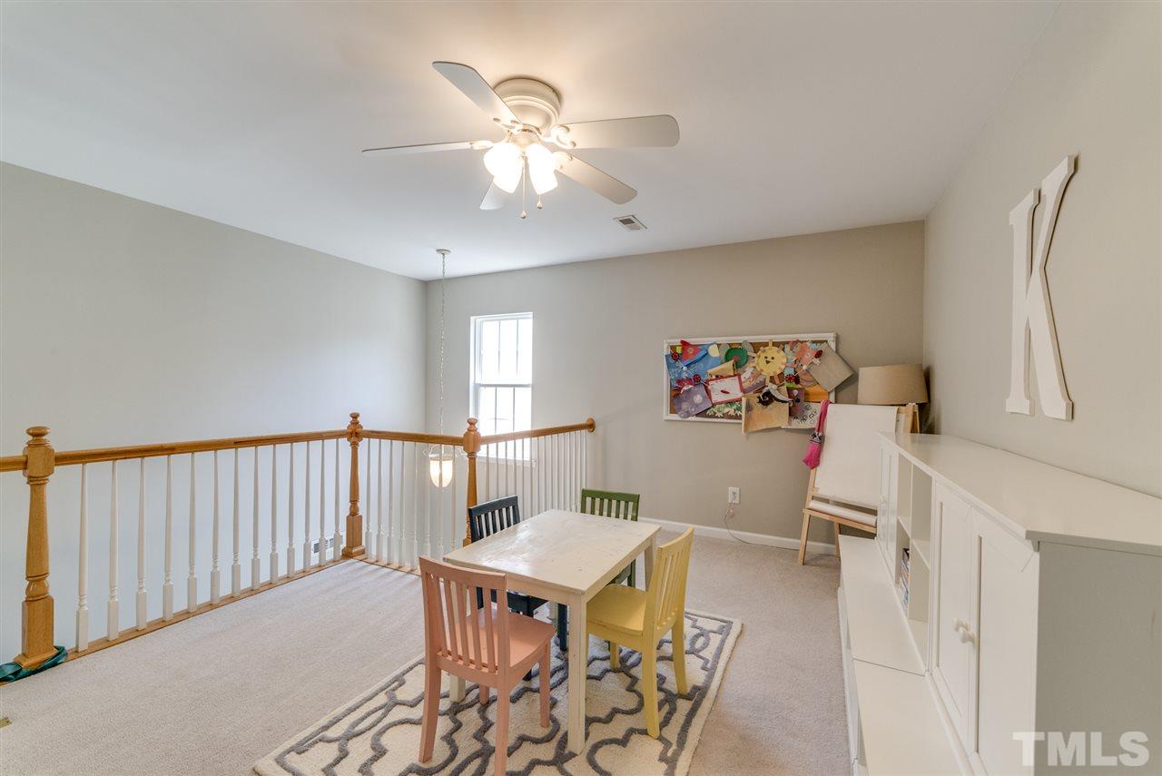 8404 Whisper Ridge Place Raleigh, NC 27613 - Photo 12 of 25 a workspace with furniture window and wooden floor
