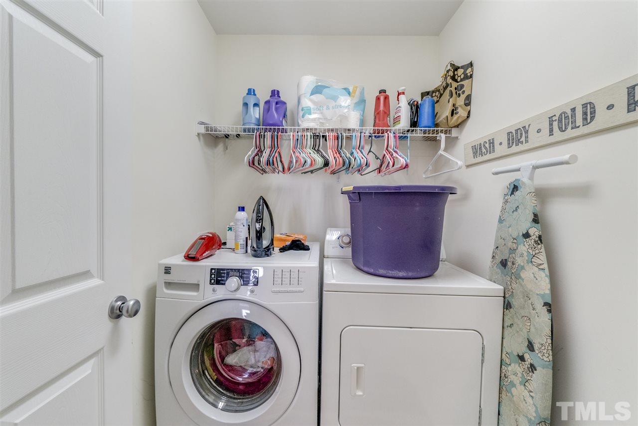 8404 Whisper Ridge Place Raleigh, NC 27613 - Photo 17 of 25 a utility room with dryer and washer