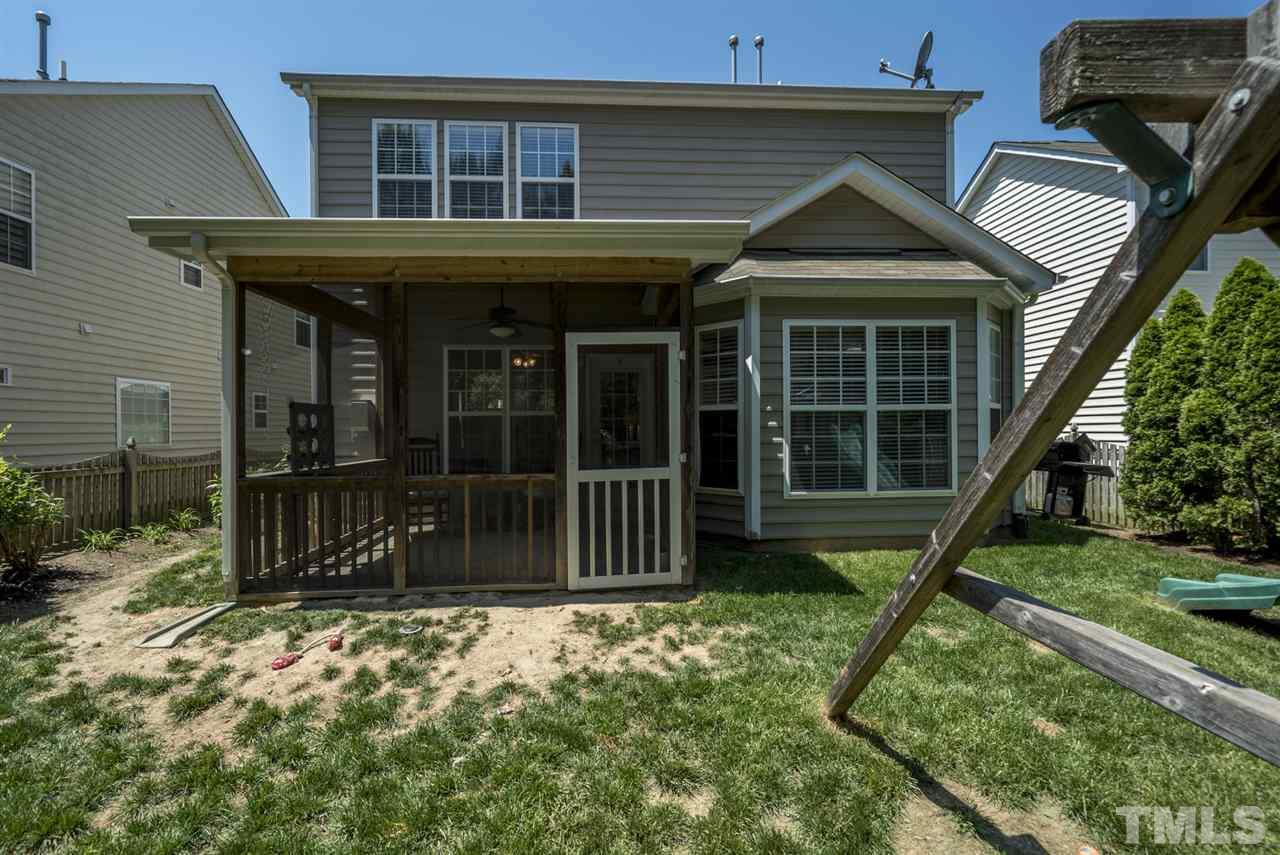 8404 Whisper Ridge Place Raleigh, NC 27613 - Photo 24 of 25 a view of a house with a yard in front of it