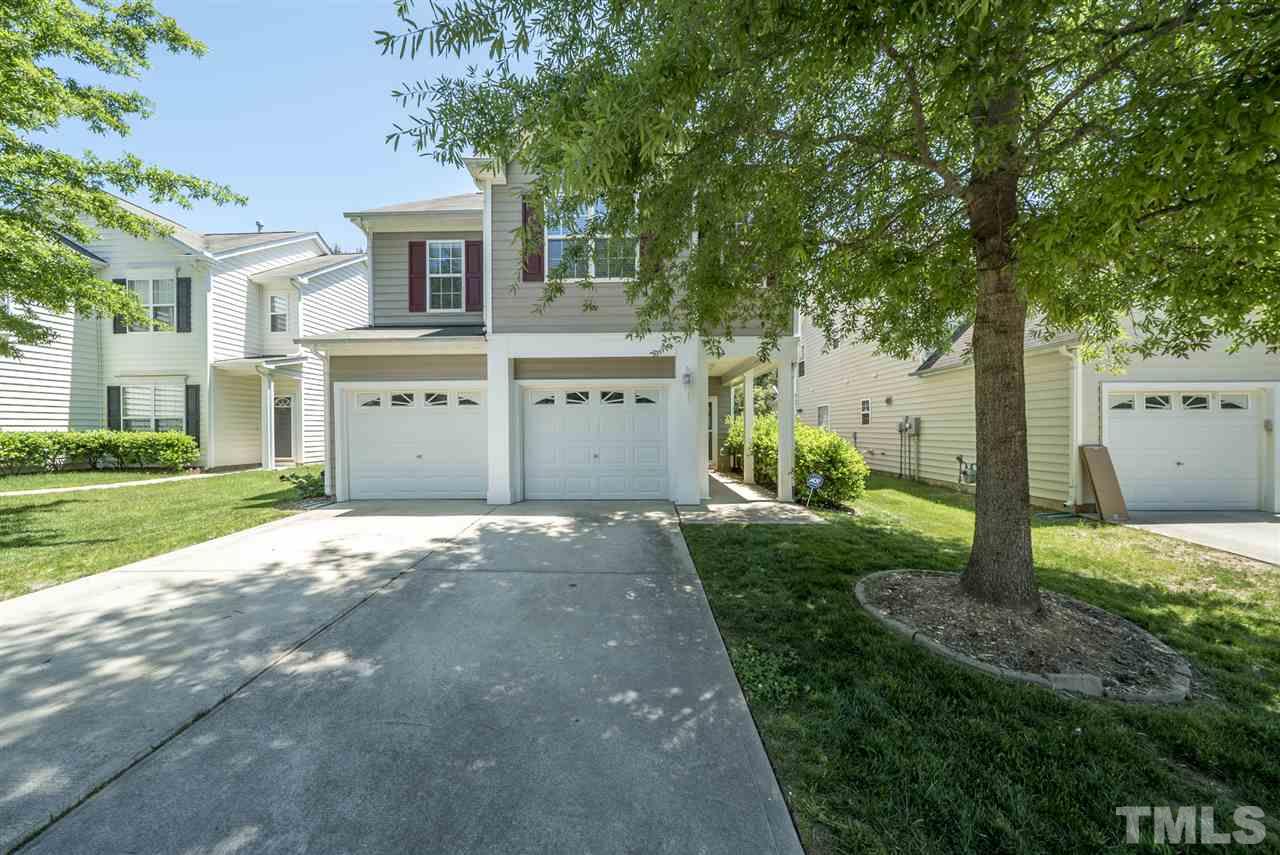 8404 Whisper Ridge Place Raleigh, NC 27613 - Photo 25 of 25 a view of a house with backyard and a tree