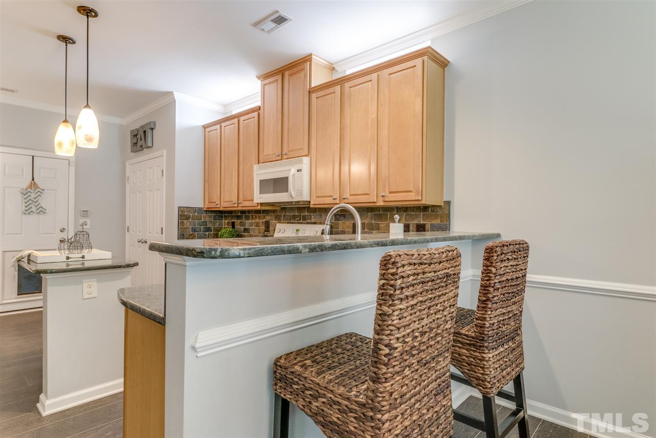 8404 Whisper Ridge Place Raleigh, NC 27613 - Photo 5 of 25 a bathroom with a sink and a mirror