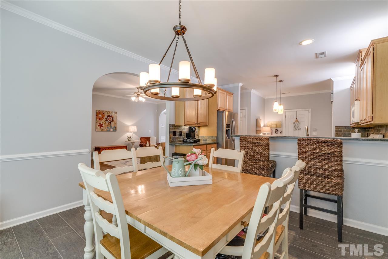 8404 Whisper Ridge Place Raleigh, NC 27613 - Photo 7 of 25 a view of a dining room and livingroom