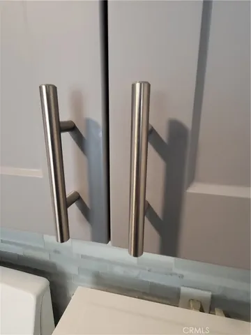 a view of hallway with furniture and a window